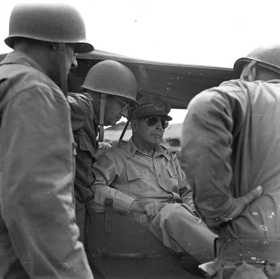Maj. Gen. Robert S. Beightler discusses the division’s operations with General in vehicle.