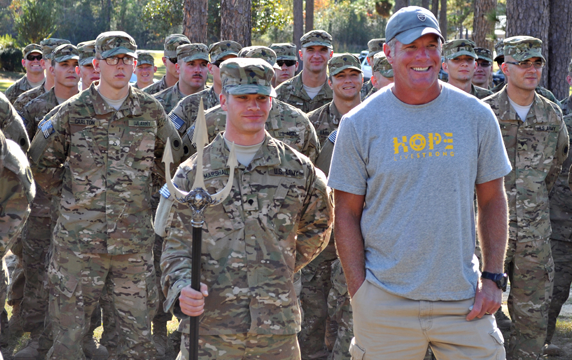 Former NFL quarterback Brett Favre stands with Soldiers of the Ohio Army National Guard's Company D, 1st Battalion, 148th Infantry Regiment,