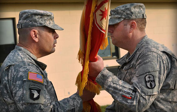 Lt. Col. Mark A. Raaker (right) accepts the Special Troops Battalion, 371st Sustainment Brigade distinguishing flag from Col. Gregory Robinette, 371st Sustainment Brigade commander, during an assumption of command ceremony April 26, 2013