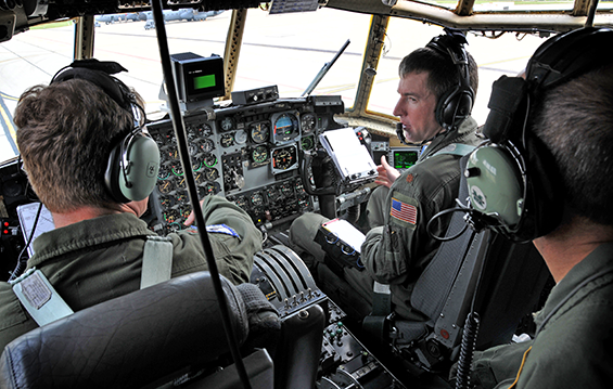 An aircrew, including Maj. Jeremy Ford (second from left), with the 179th Airlift Wing in Mansfield, Ohio, prepares to conduct the wing's first flight 