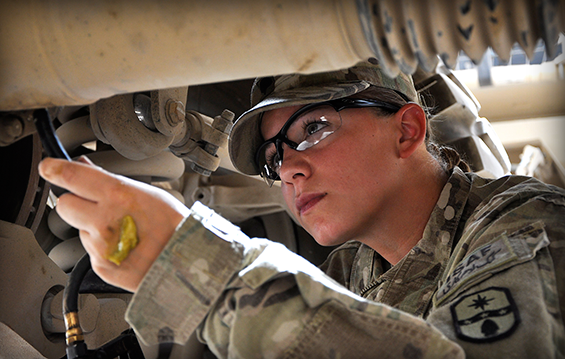 Spc. Michelle Metzger, a motor transport operator with the 1487th Transportation Company, Ohio Army National Guard, checks the oil in her vehicle 