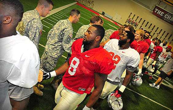 Ohio National Guard members meet Ohio State University football players after a practice