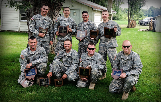 members of the marksmanship team from Company C, 1st Battalion, 145th Armored Regiment, display the awards they earned after competing in the Adjutant General's Combat Marksmanship Championship
