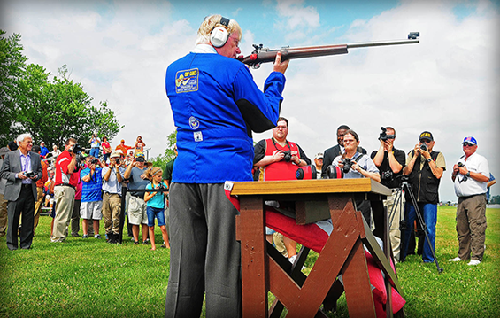 Gary Anderson, director emeritus of the Civilian Marksmanship Program, fires the ceremonial first shot of the 2014 National Rifle and Pistol Matches.