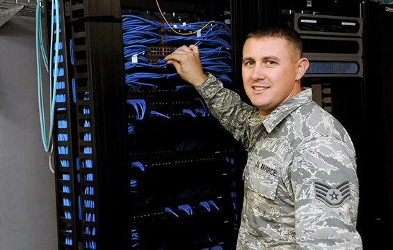 Staff Sgt. Chris Khoma, an Airman with the 178th Communications Flight, works on a computer system after the Command Cyber Readiness Inspection.