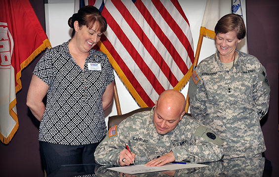 Lt. Col. Ben Capriato, commander, 16th Engineer Brigade, signs an Employer Support of the Guard and Reserve Statement of Support 