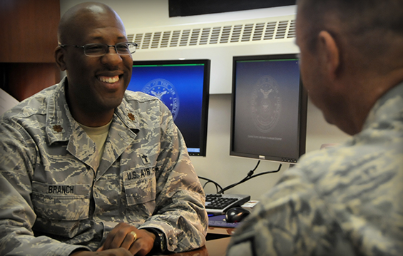 Chaplain (Maj.) Joseph Branch of the 178th Wing speaks with an Airman.