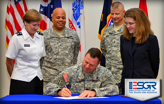 Lt. Col. Daniel Shank, 73rd Troop Command administrative officer, signs an ESGR Statement of Support .