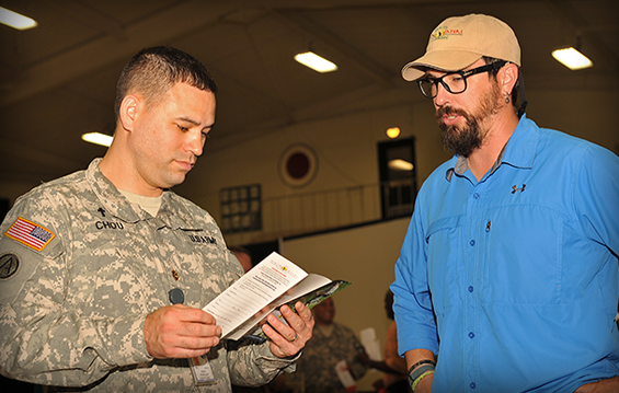 Nicholas Chou, Special Troops Command, gathers information from Dietrich Stallsworth