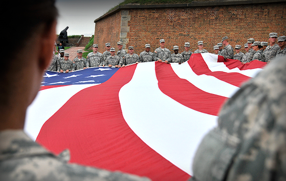 Army National Guard officer candidates prepare to fold a garrison flag 