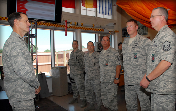 Lt. Gen. Stanley E. Clarke III (left), director of the Air National Guard, speaks with Airmen 