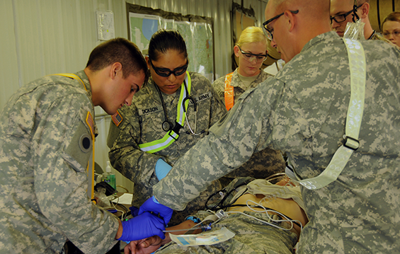 Combat medics from Company C, 237th Support Battalion, 37th Infantry Brigade Combat Team, treat simulated casualties after an ambush training exercise.