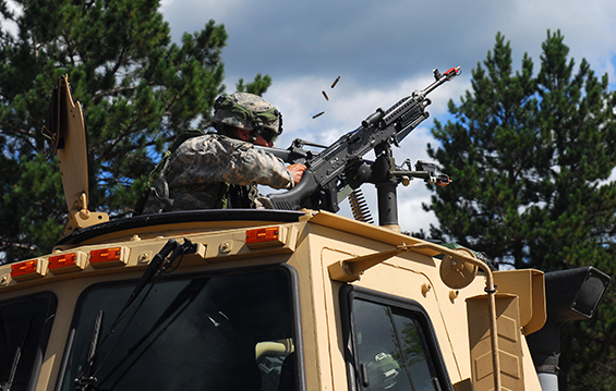Spc. Zack Foster, a member of the 1484th Transportation Company, returns fire during a simulated ambush.