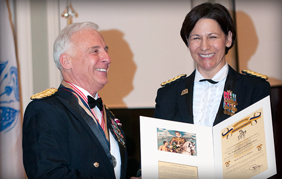 Brig. Gen. Michael W. McHenry, deputy commanding general-support, 38th Infantry Division, receives the Order of Saint Martin Medal from Brig. Gen. Maria Kelly.