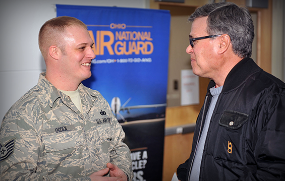 Tech. Sgt. Tyler Ogden (left), a recruiter for the 178th Wing, speaks with one of about 500 veterans who attended the Veterans Resource Fair.
