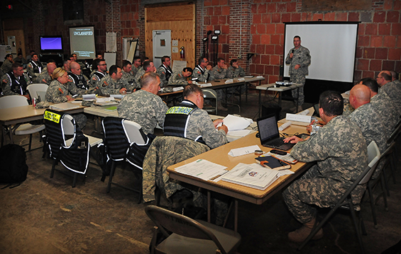 Lt. Col. Dan Shank, deputy commander of the Ohio Homeland Response Force, briefs the HRF leadership and staff .