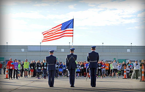 The 180th Fighter Wing Color Guard presents the colors during the national anthem before the I Believe I Can Fly 5K.