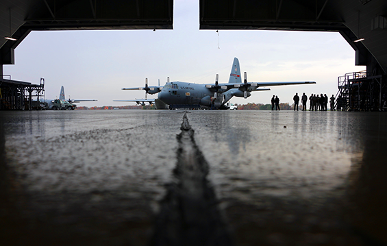 A C-130H Hercules sits outside a hangar at the 179th Airlift Wing.