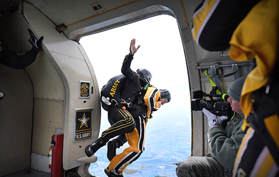 Col. Craig Baker, then-commander of the 180th Fighter Wing, tandem jumps with Staff Sgt. Jon Lopez, a member of the U.S. Army Parachute Team, to kick off the Toledo Air Show.