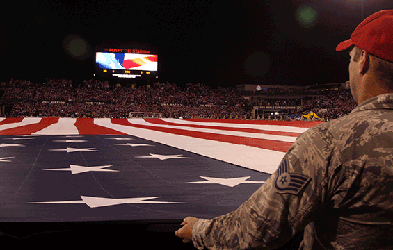 An Ohio National Guard Airman helps present the American flag during the opening ceremony of the FIFA World Cup qualifier between the U.S. and Mexico.