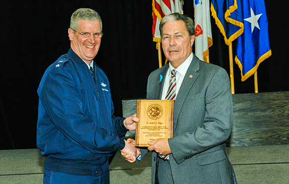 Maj. Gen. Mark E. Bartman (left), Ohio adjutant general, presents a plaque of appreciation to Dr. Robert L. Boggs, deputy director, People and Culture Directorate, Defense Logistics Agency Land and Maritime.