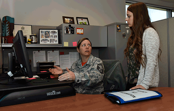 Master Sgt. Amy Lolo (left), a training manager with to the 180th Fighter Wing in Swanton, Ohio, talks with her daughter, Samantha, during a recent bring your child to work day.