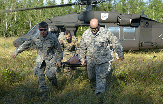 National Guard Airmen work with Soldiers from Company C, 3rd Battalion, 238th Aviation Regiment during medevac training as part of Northern Strike ‘17.