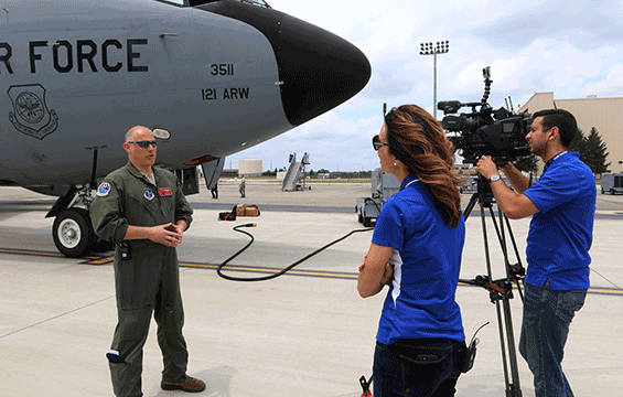 Anchor/reporter Stacia Naquin and videographer Jeff Hogan, of WSYX/WTTE-TV in Columbus, Ohio, interview Master Sgt. Ryan Dunn, a boom operator with the 121st Air Refueling Wing.