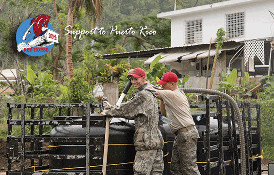 2 Guard Members of the 200th Red Horse fill two tanks with potable water.