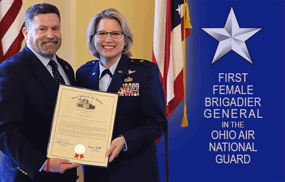 Two holding commendation with one-star graphic reading First Female Biragier General in the Ohio Air National Guard