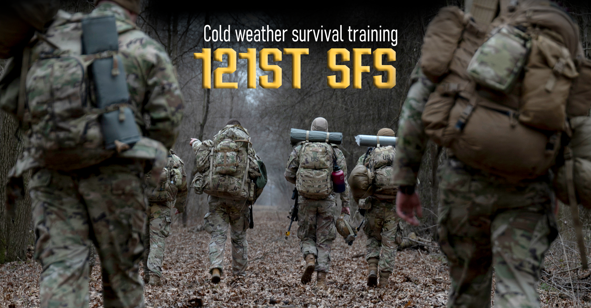 Airmen walk carrying rucksacks