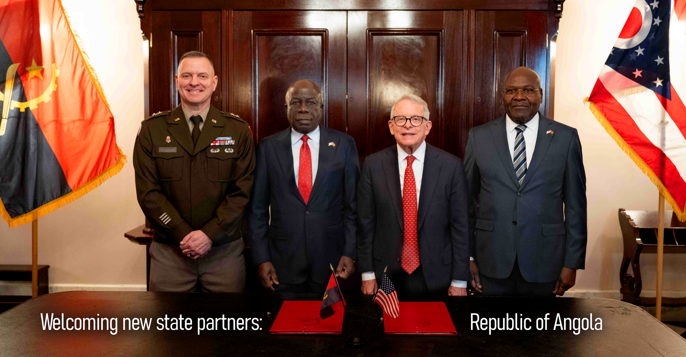 Ohio Govenor Mike DeWine and Ohio Adjutant General Maj. Gen. Woodruff stand with representatives from Angola