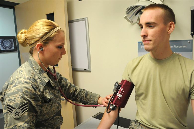 Senior Airman Caitlin Noah, 178th Health Systems Technician checks blood pressure of Senior Airman Brian McGinnis during a routine medical exam at the 178th Wing, Springfield Air National Guard Base, Springfield, Ohio.Pysical exams are an important part of maintaining readiness.
