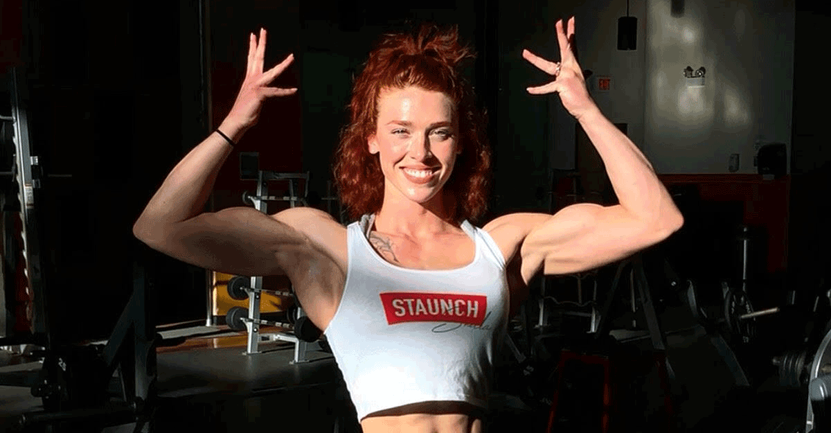 Senior Airman Amanda Wilson poses in gym.