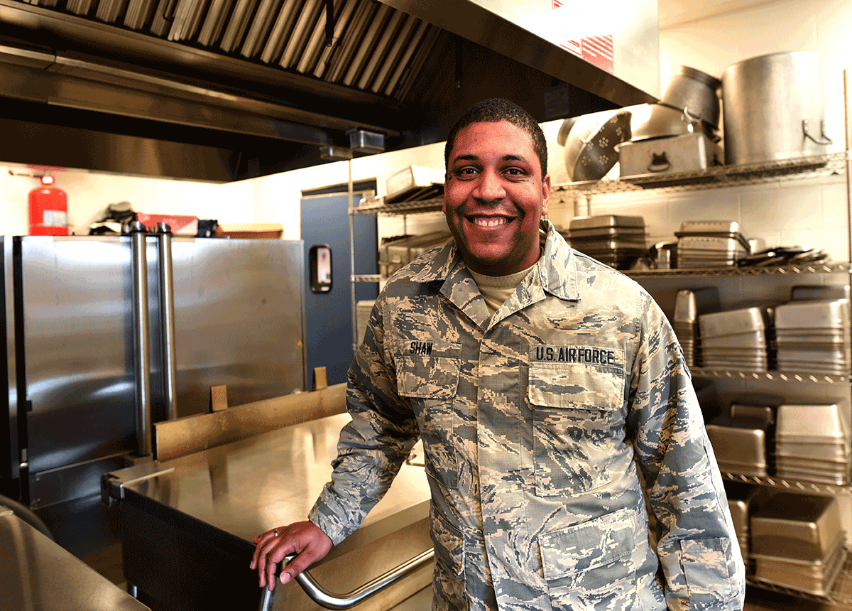 . Senior Airman Tyrell Shaw stands for a photo in the dining facility.