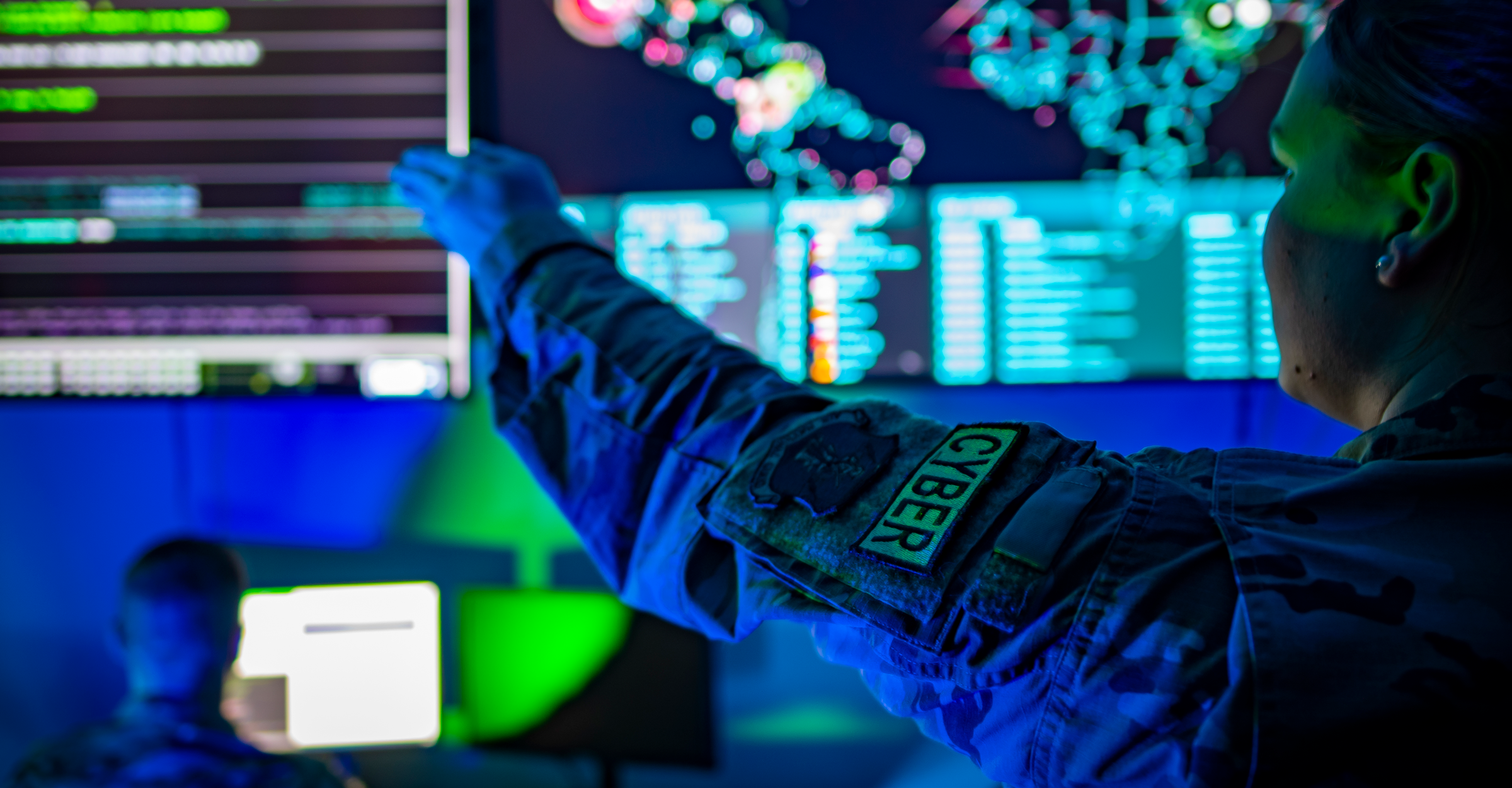 Airman points at screen