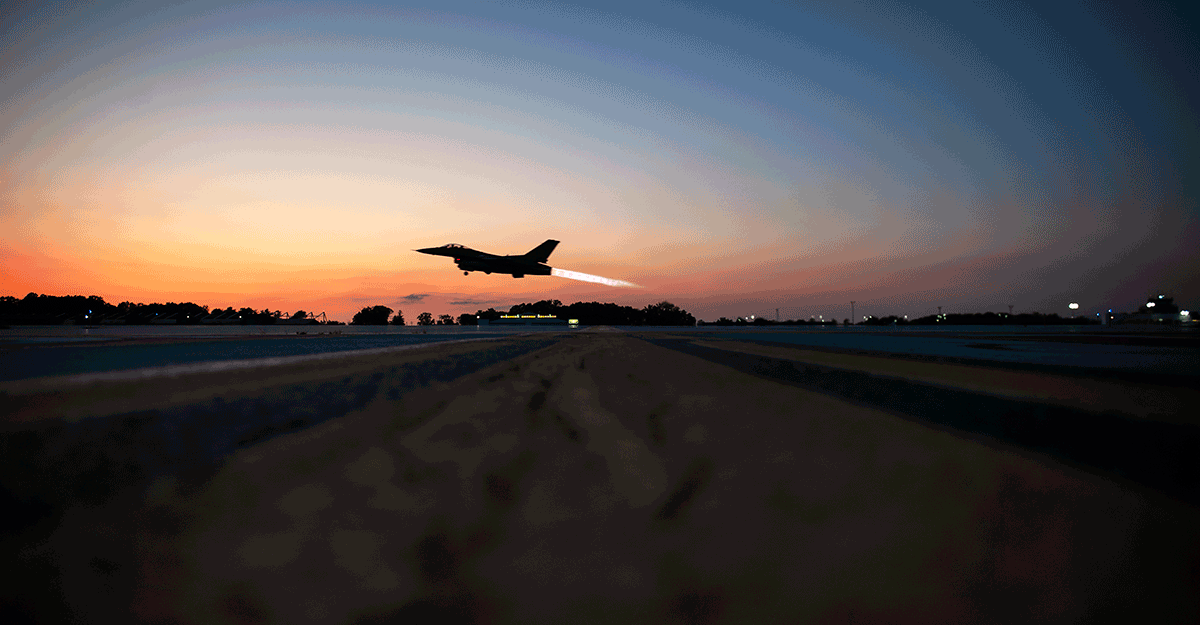 F-16 Fighting Falcon takes off at nighttime.