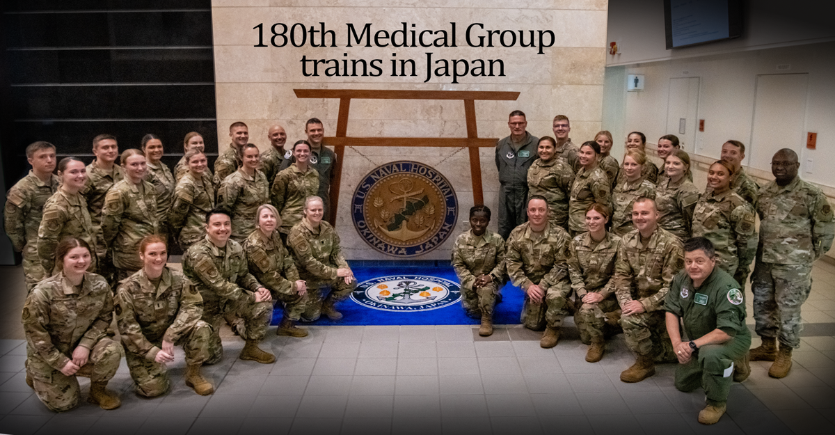 Airmen with the 180th Medical Group gather for a group photo at U.S. Naval Hospital Okinawa, Japan, July 14, 2023. The annual training provided the Airmen an opportunity to perform a wider scope of medical tasks than they normally would, work with other military branches in a joint environment and augment permanent staff.