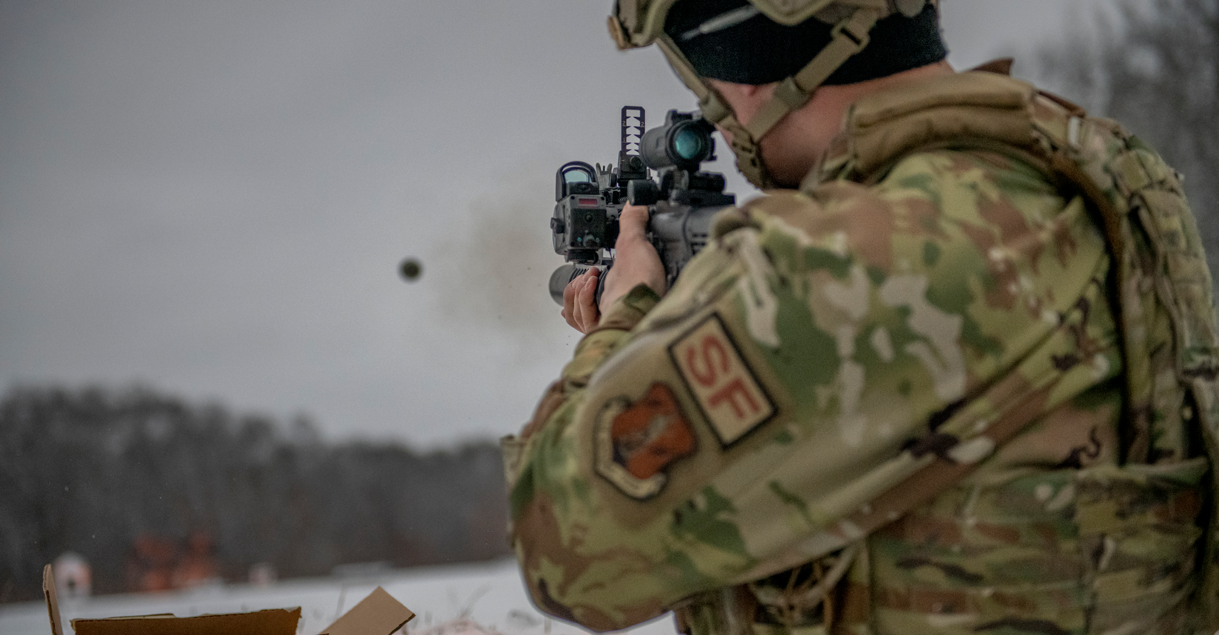 An Airman fires an M203 grenade launcher