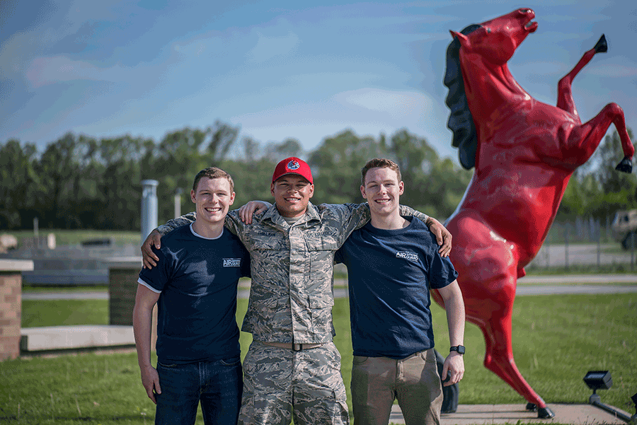 Brothers Tyler Jenkins, SrA Anthony Thielman and Dylan Jenkins, all members of the 200th REDHORSE Squadron, pose for a photograph May 19, 2019, at the 200th REDHORSE Squadron, Mansfield, Ohio with red horse statue.