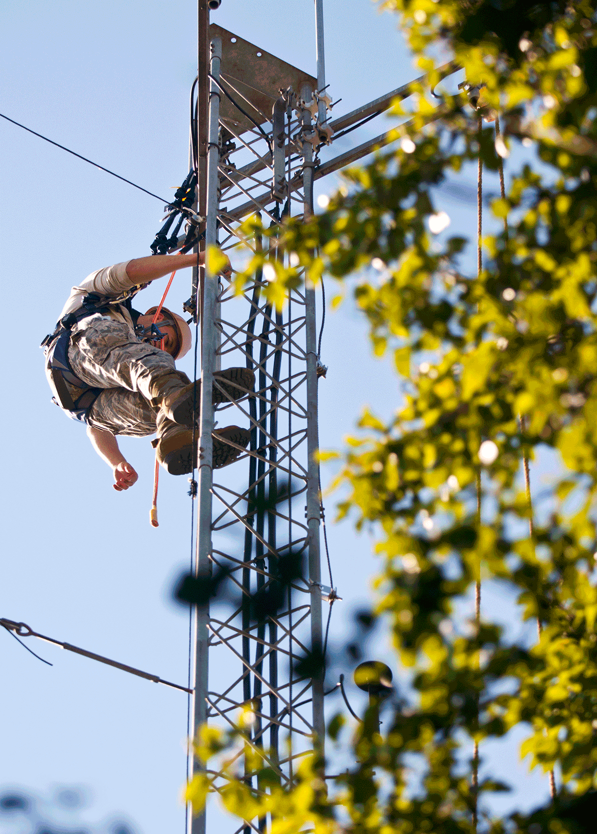 Staff Sgt. performs an antenna preventative maintenance inspection perched high on a tower. 