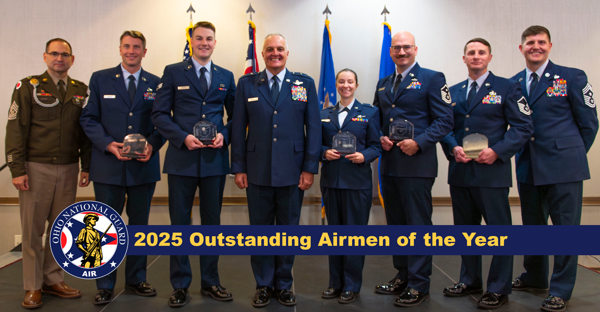 Group photo of Airmen holding awards