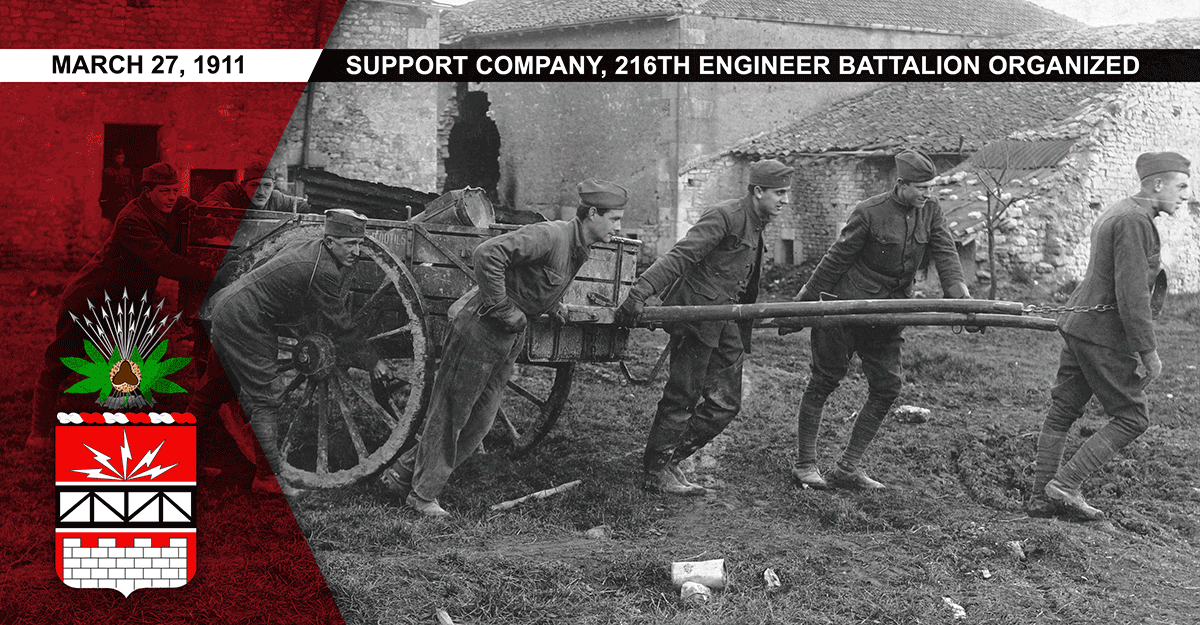 Men of Battery D pull a cart while doing salvage work.