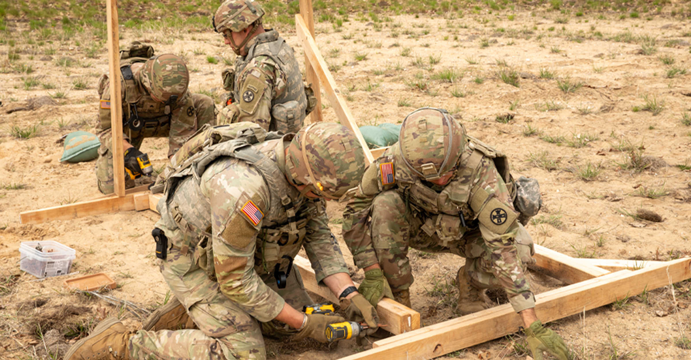 112TH ENGINEER BATTALION: Soldiers repair a door frame in between iterations of urban demolition breaching during annual training. Combat engineers navigate rough terrain and physical obstacles by clearing barriers with explosives, constructing obstacles and defensive positions and detecting hazards.