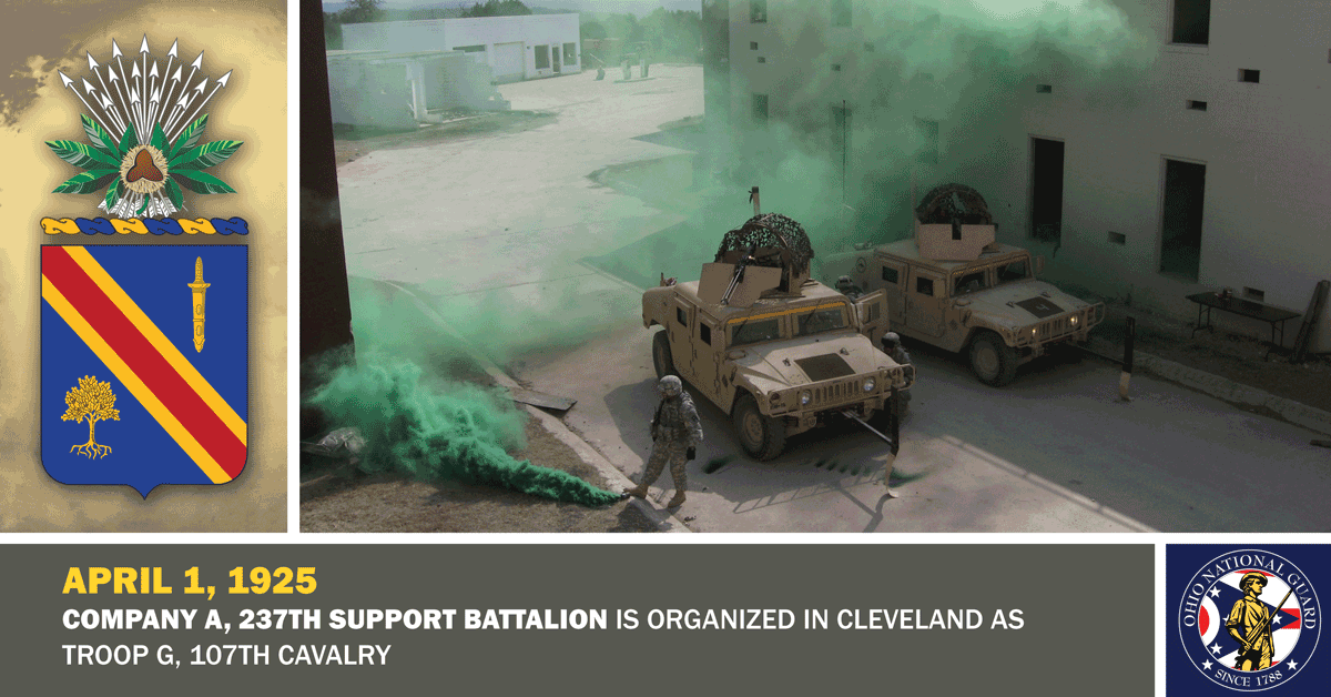 Soldiers deploy green smoke screen for humvees on street.
