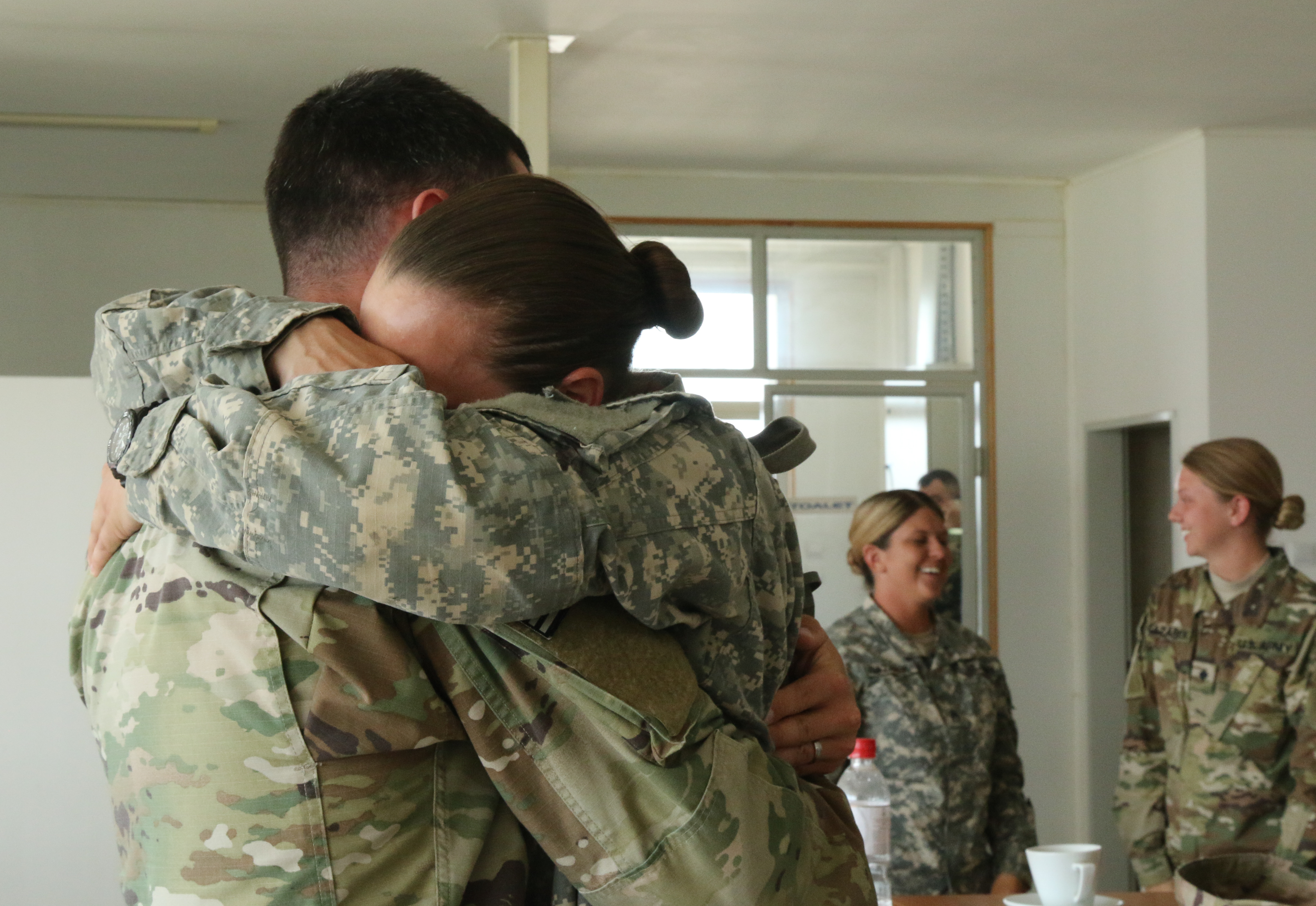Army Spc. Mackenzie Crawford, a military police officer with the 585th Military Police Company, embraces her brother Army Spc. Matthew Crawford, who is currently deployed to Kosovo with Headquarters Headquarters Company for a peacekeeping operation, on June 21, 2017 on South Base, Serbia. Mackenzie is here in Serbia for Paltinum Wolf. (U.S. Army photo by Spc. Emilie Sheridan/Released)
