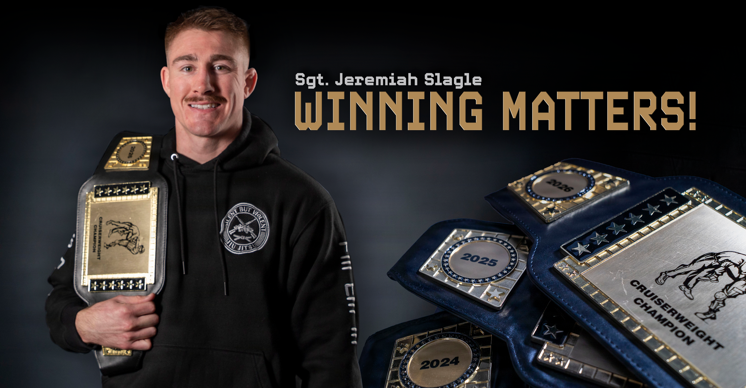 Sgt. Jeremiah Slagle holding champion belt