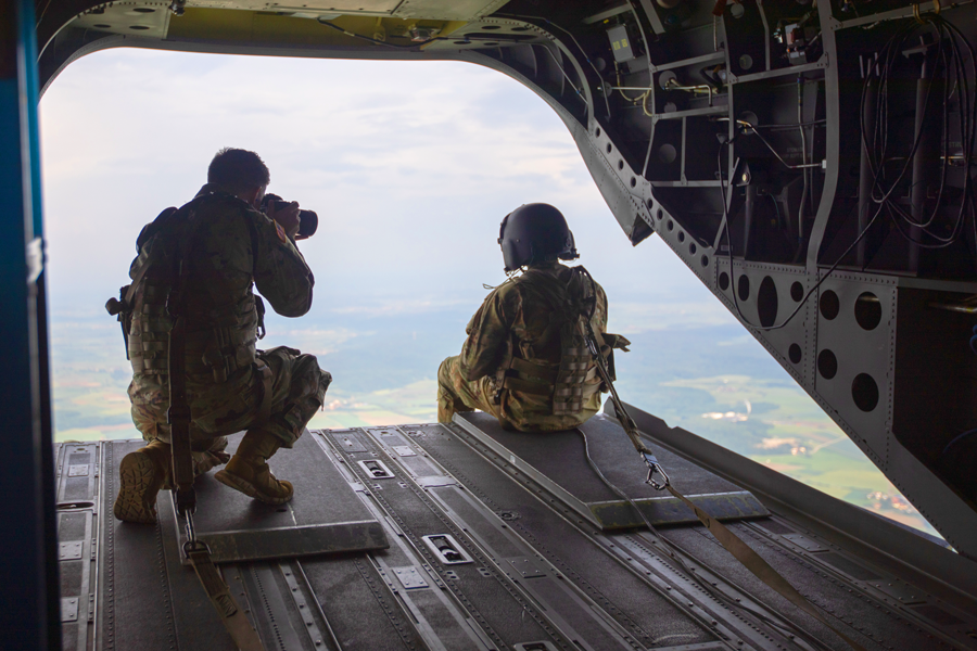 Color photo of Soldiers on back of C-130.