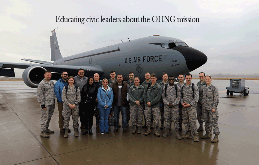 Group of Ohio civic leaders stand in front of KC-135