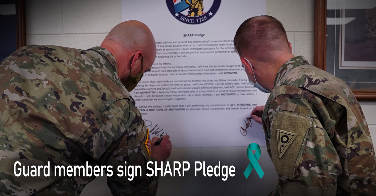 Soldiers sign pledge.